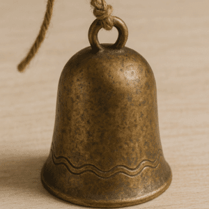 A Caravan Bell of Absence, a small, ornate bell with a weathered metallic finish and intricate engravings, photographed against a neutral background.