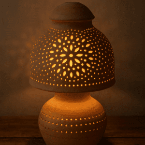Dreamglow Terracotta Lamp with warm light glowing inside